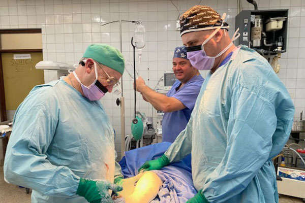 Pictured from left to right, are: Steve Mannion, Alan Monks and Clive Chenery performing a surgical procedure. Pictured from left to right, are: Steve Mannion, Alan Monks and Clive Chenery performing a surgical procedure.