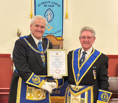 Andy Whittle presents Colin Rowan with his 50-year framed certificate. Andy Whittle presents Colin Rowan with his 50-year framed certificate.
