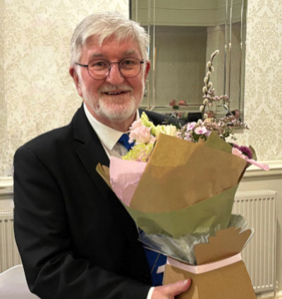 John Robson with flowers from the lodge for Mrs Robson. John Robson with flowers from the lodge for Mrs Robson.