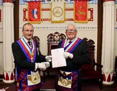 Ian Sanderson (left) presents Peter Connolly with his 60 years in the Royal Arch certificate. Ian Sanderson (left) presents Peter Connolly with his 60 years in the Royal Arch certificate.