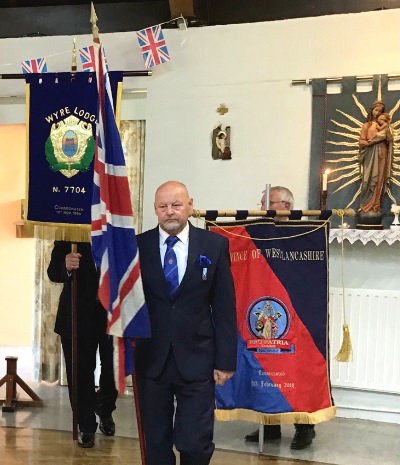 North Fylde Group Chairman John Cross leading the banner procession. North Fylde Group Chairman John Cross leading the banner procession.