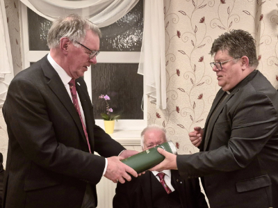 John Robbie Porter (left) receiving a bottle of whisky from John Hall. John Robbie Porter (left) receiving a bottle of whisky from John Hall.
