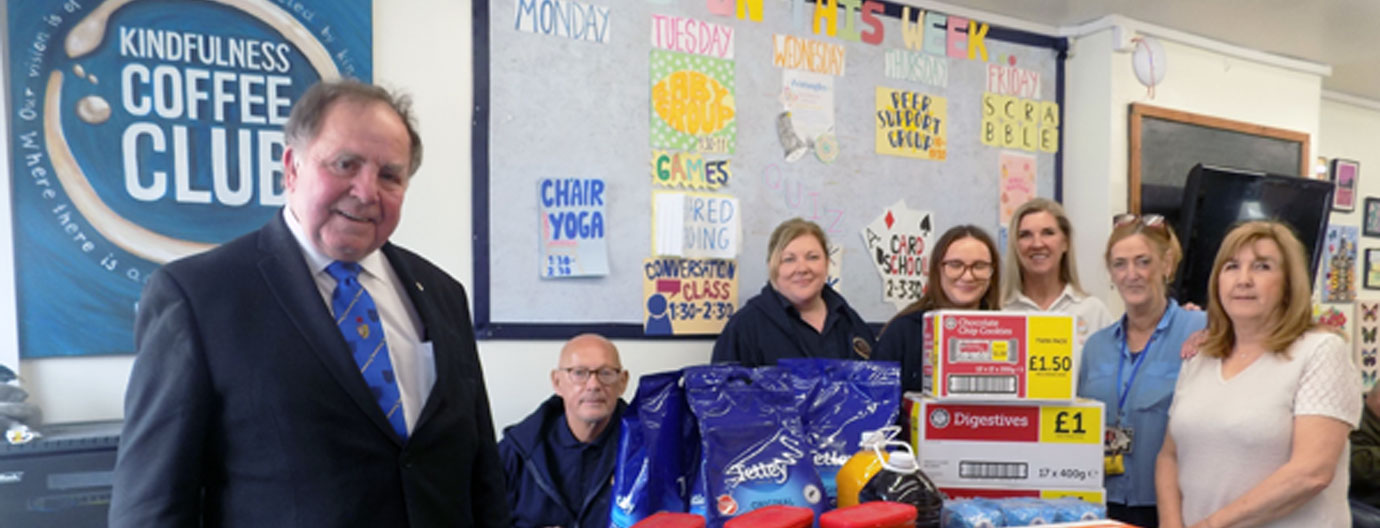 Graham presents supplies to volunteers and part time staff at the Kindfullness Coffee Club, Bootle. Graham presents supplies to volunteers and part time staff at the Kindfullness Coffee Club, Bootle.