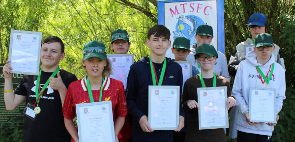 All nine students with their certificates and medals. All nine students with their certificates and medals.