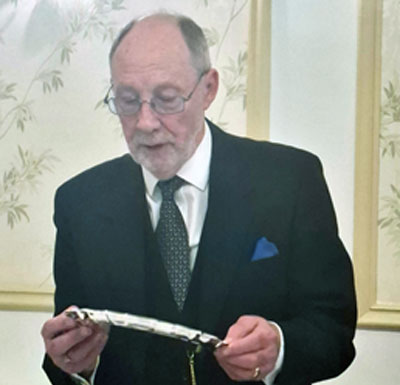 Cliff admires his commemorative plate, specially produced by the members of the lodge. Cliff admires his commemorative plate, specially produced by the members of the lodge.