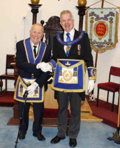 John Youldon (left) being congratulated by Stuart Boyd. John Youldon (left) being congratulated by Stuart Boyd.