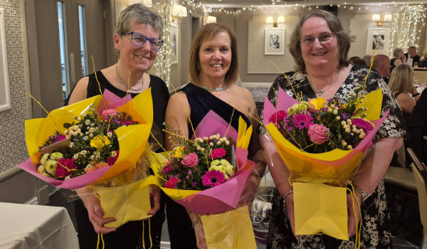 Pictured from left to right, are: Sue Porter, Shelagh Cross and Helen Barr with the beautiful bouquets of flowers presented to them. Pictured from left to right, are: Sue Porter, Shelagh Cross and Helen Barr with the beautiful bouquets of flowers presented to them.