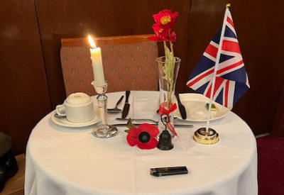 A table set to represent absent brethren. A table set to represent absent brethren.