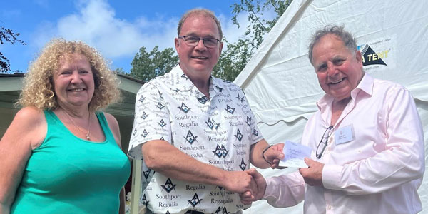 Gillian and Alister Sainter present the cheque to Graham Chambers. Gillian and Alister Sainter present the cheque to Graham Chambers.