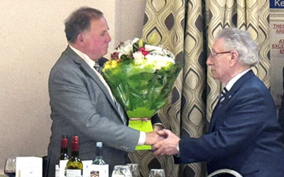 Graham (left) receives flowers for his wife Anne, from Malcolm Sandywell. Graham (left) receives flowers for his wife Anne, from Malcolm Sandywell.