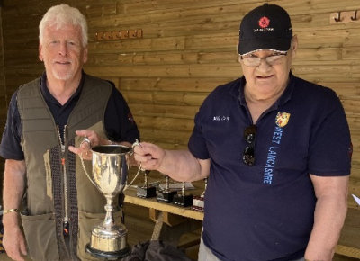 High Gun winner Dave Smith (left) receiving the High Gun Trophy from Mike Casey. High Gun winner Dave Smith (left) receiving the High Gun Trophy from Mike Casey.